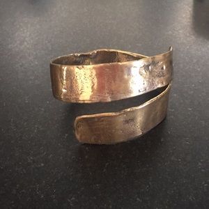 Brass bracelet hand crafted as a swirl